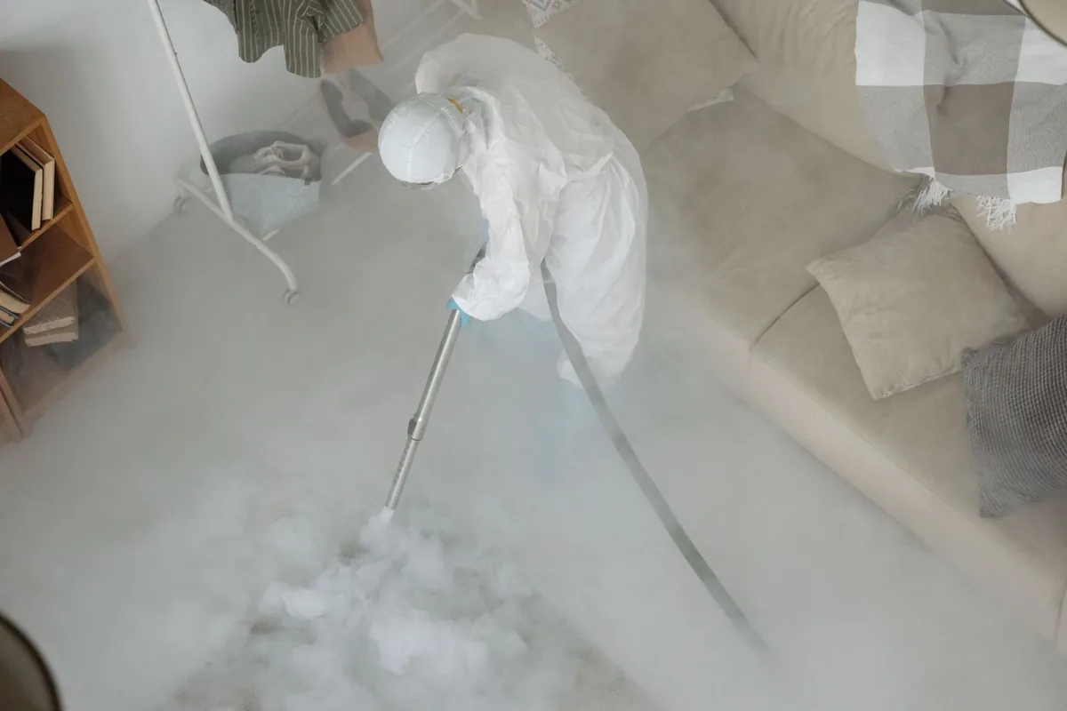 Biohazard cleanup technician in protective equipment, Glide, OR
